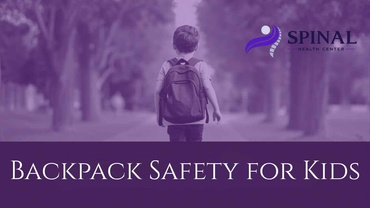 A child wearing a backpack with Spinal Health Center Logo